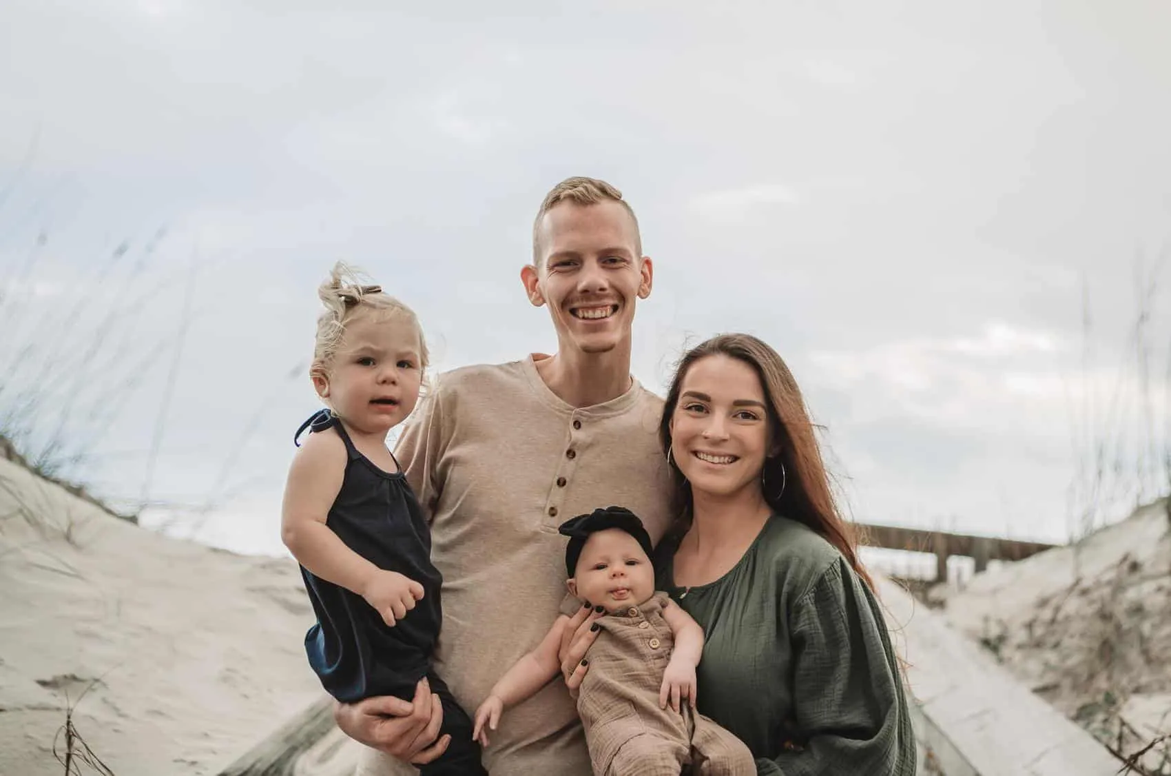 Family of four together at the 3rd Street access on Atlantic Beach in Jacksonville
