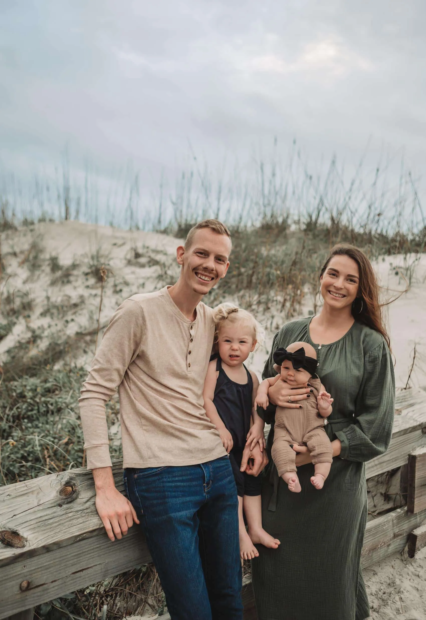 Family of four together at the 3rd Street access on Atlantic Beach in Jacksonville