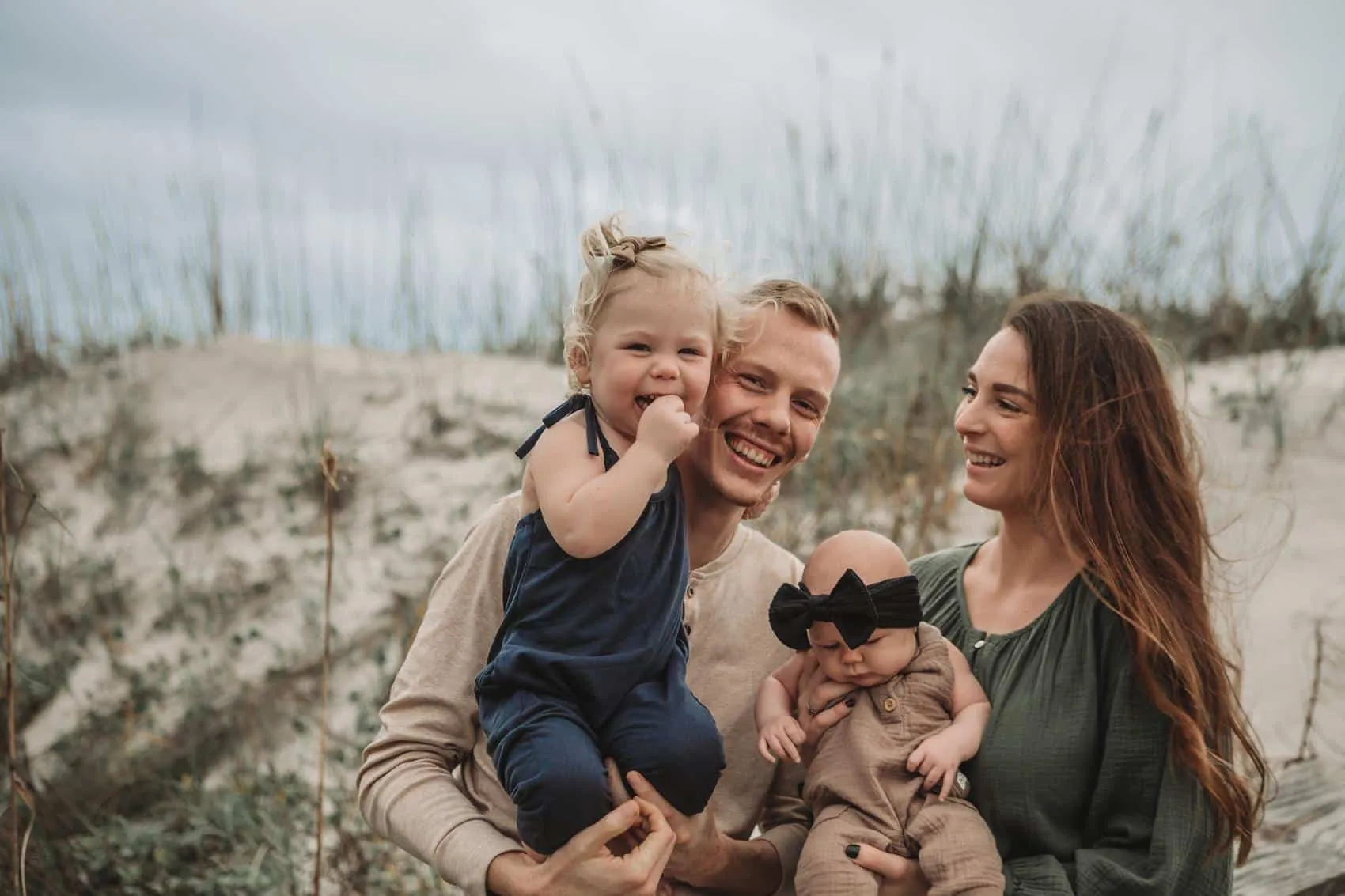 Family of four together at the 3rd Street access on Atlantic Beach in Jacksonville