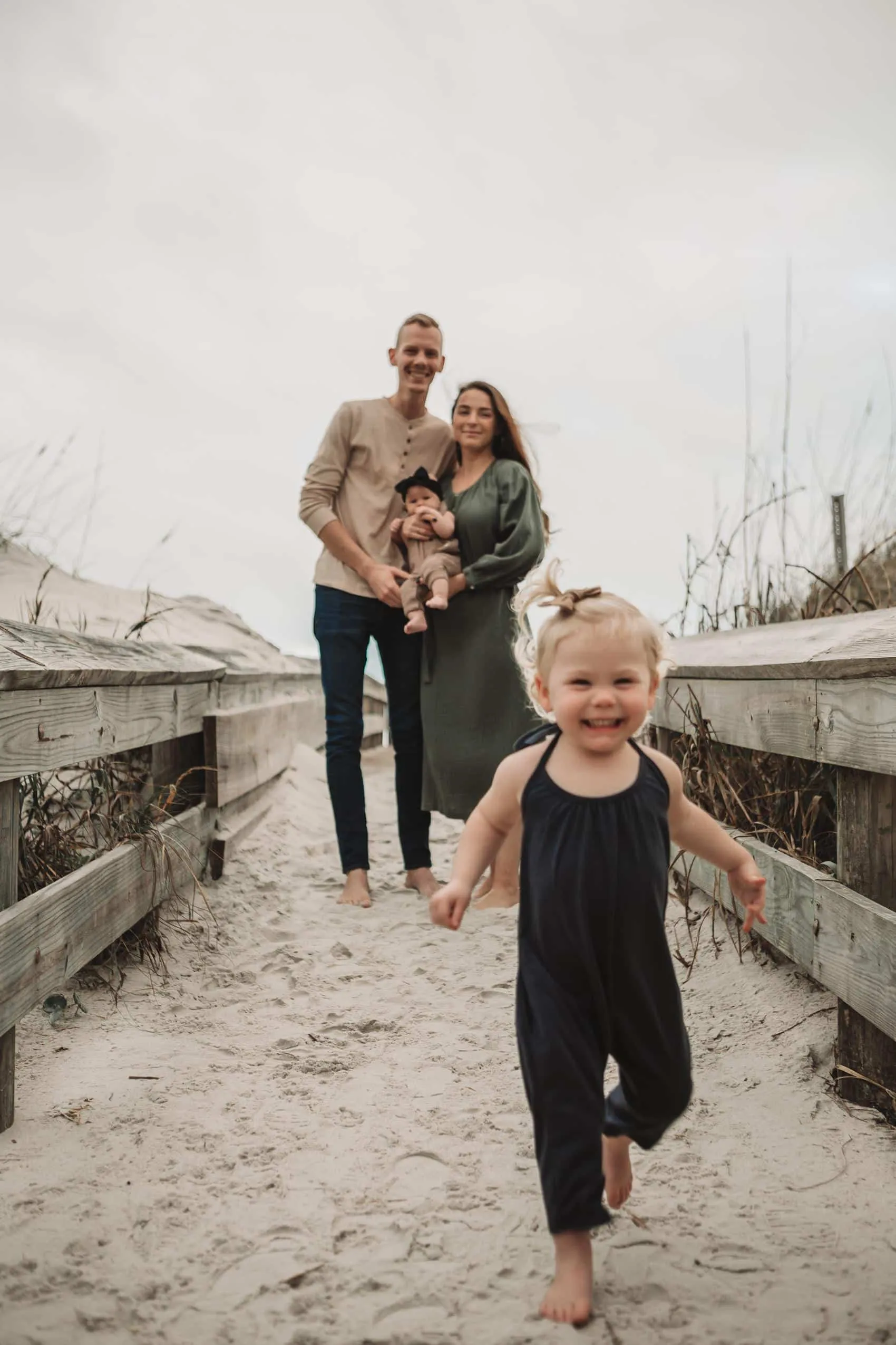 Family of four together at the 3rd Street access on Atlantic Beach in Jacksonville