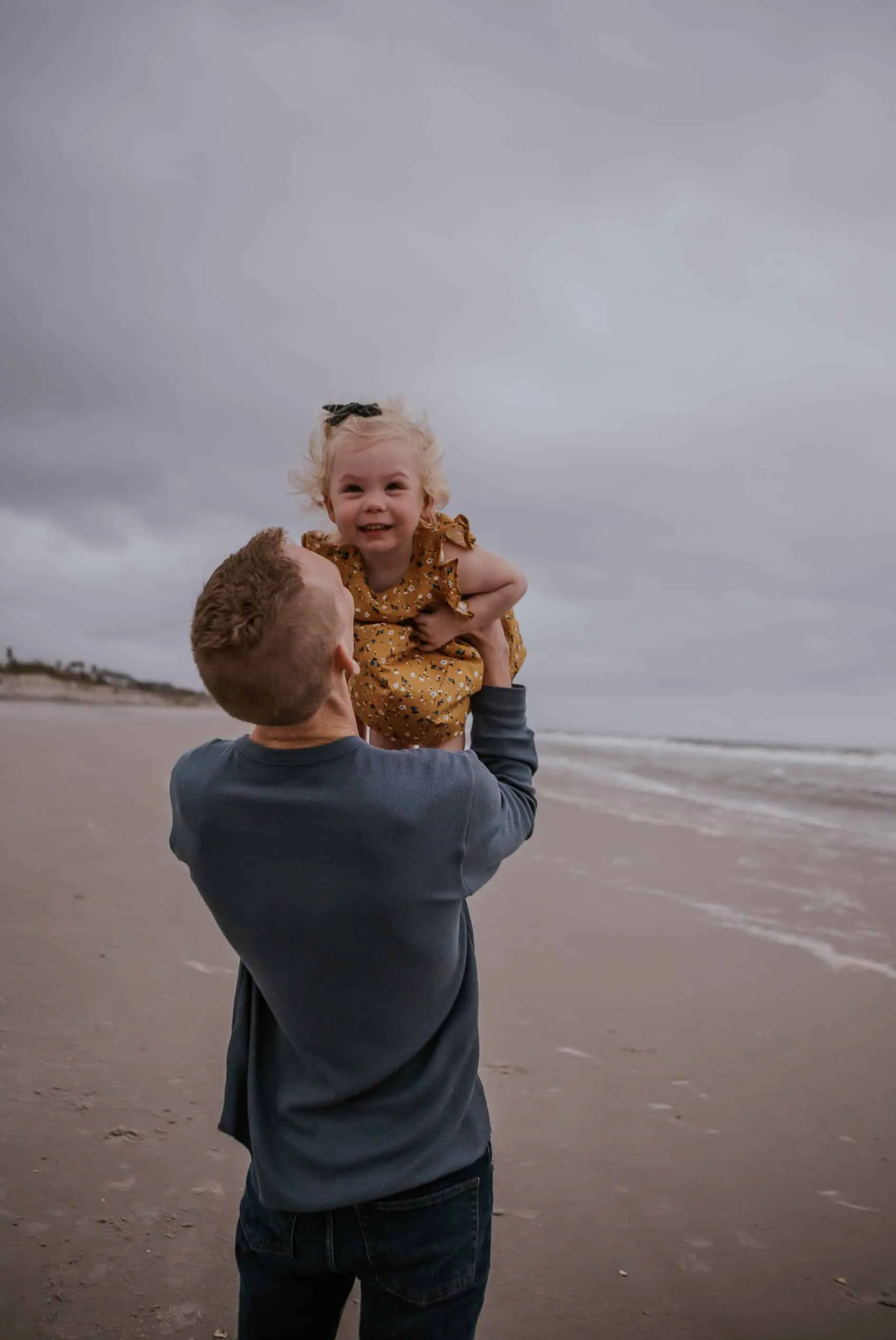 Family of four together at the 3rd Street access on Atlantic Beach in Jacksonville