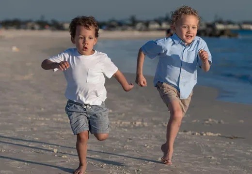 Children running on the beach at Lido Key, Florida