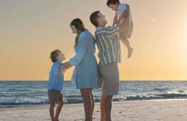 Family in coordinating outfits on Siesta Key beach