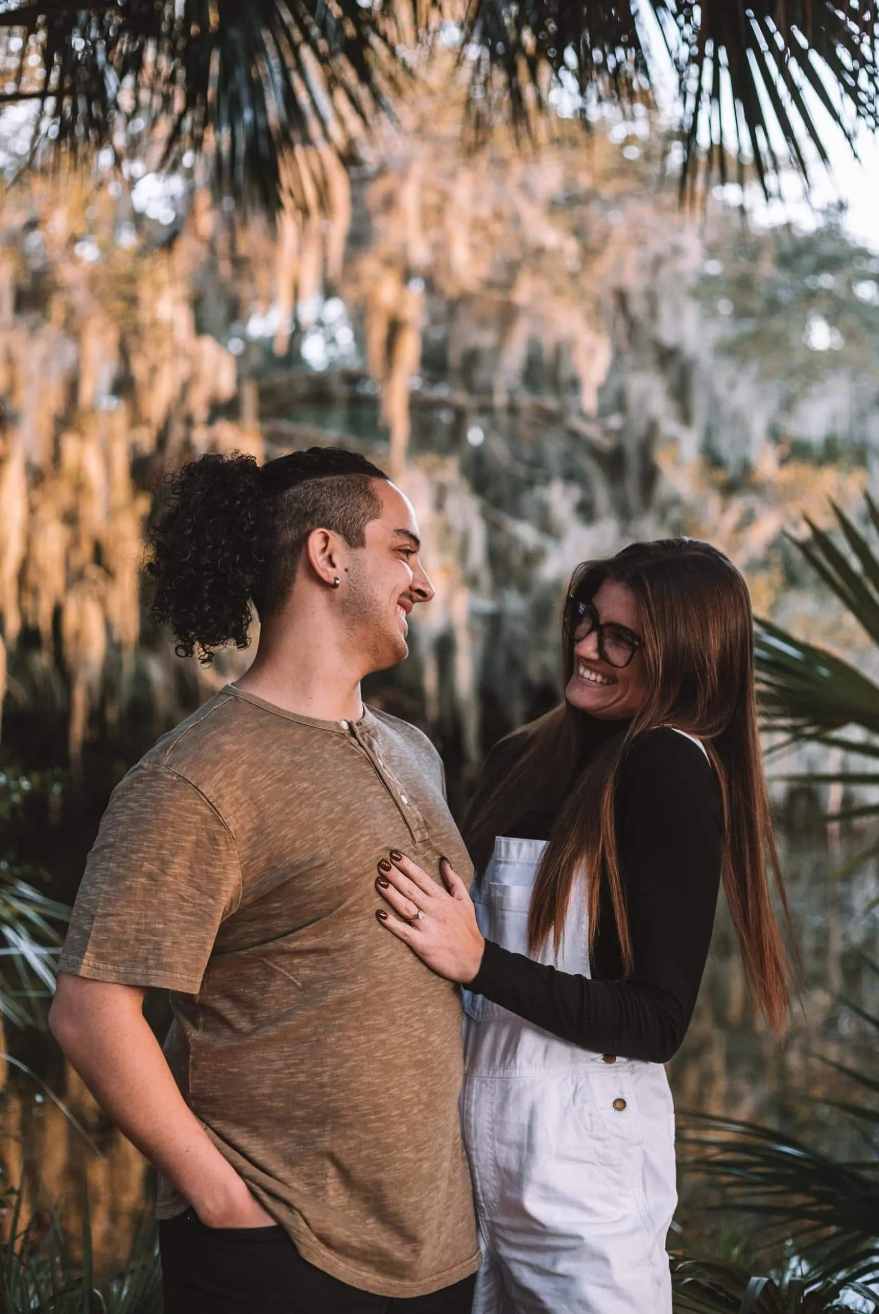 Couple together among the greenery at Hanna Park in Jacksonville