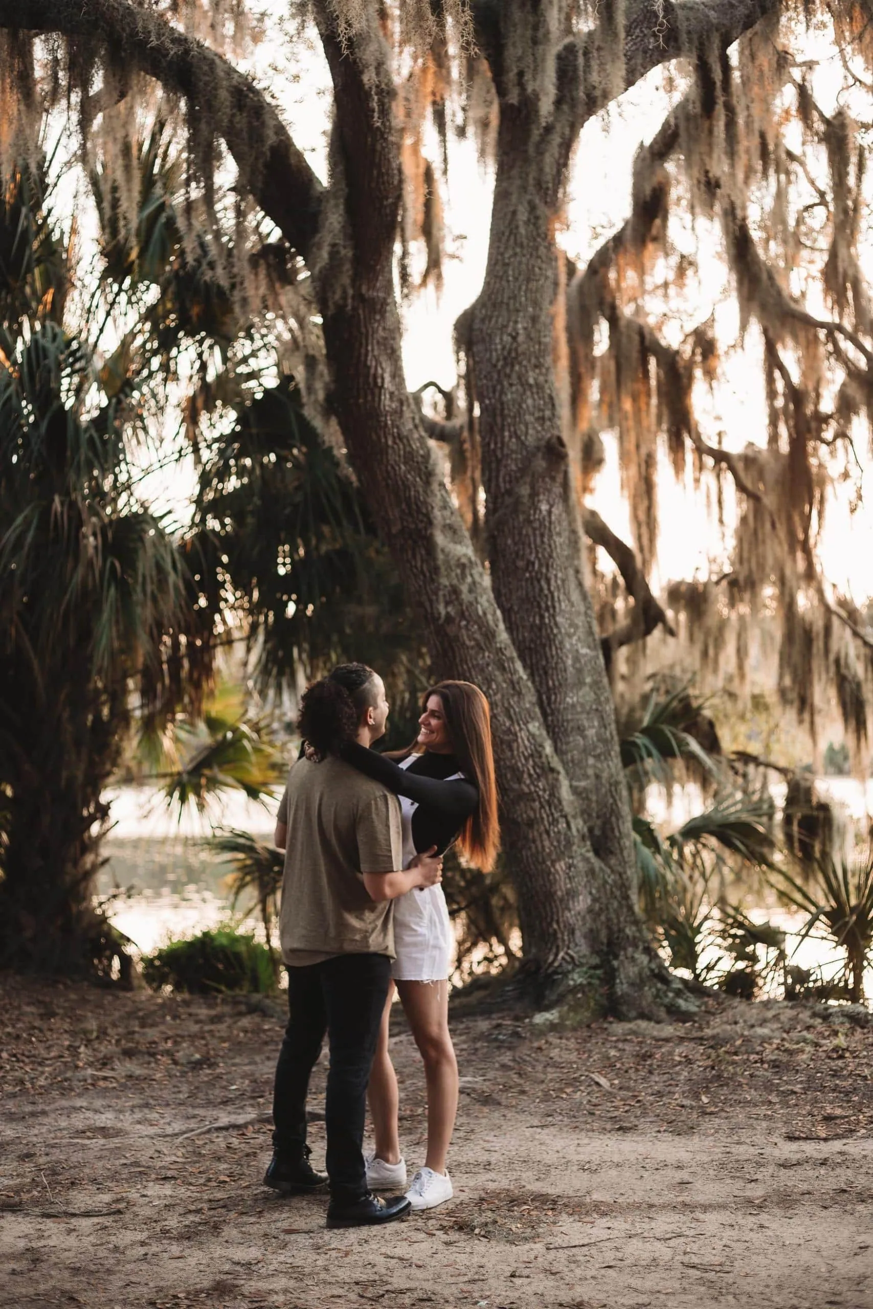 Couple together among the greenery at Hanna Park in Jacksonville