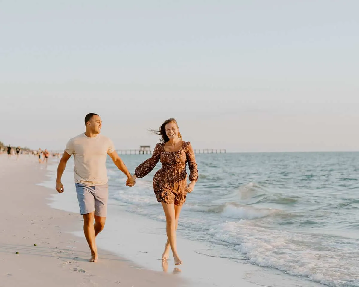Couple embracing at sunset on Siesta Key Beach in spring