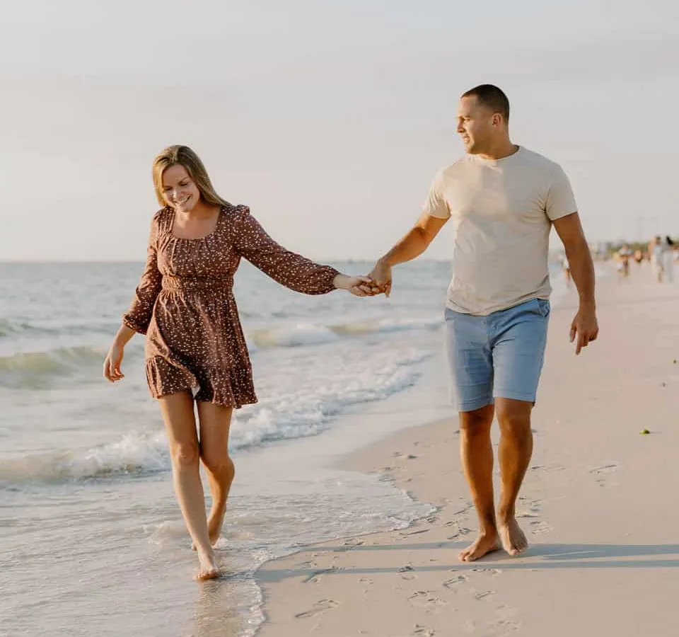 Couple embracing at sunset on Siesta Key Beach in spring