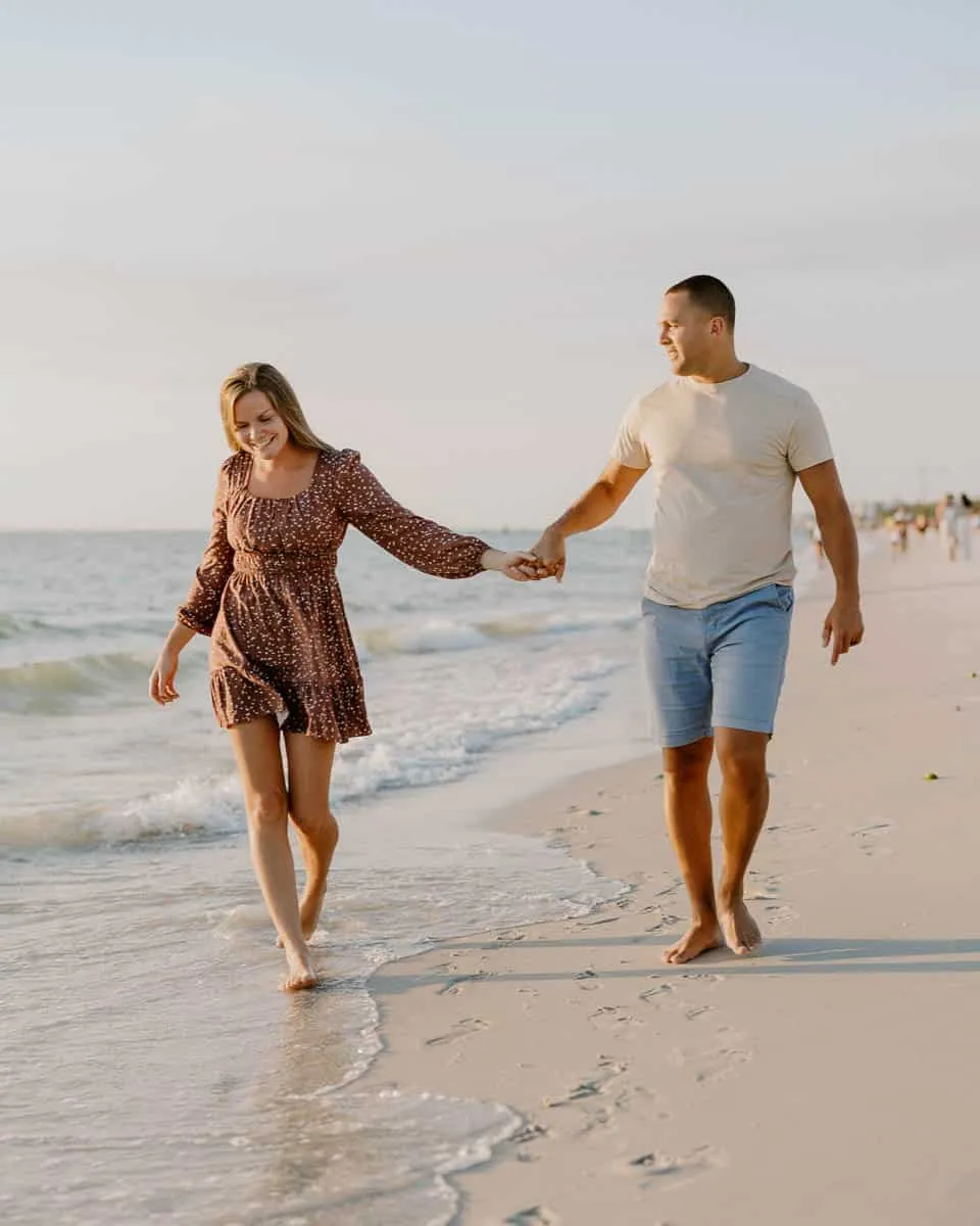 Couple embracing at sunset on Siesta Key Beach in spring