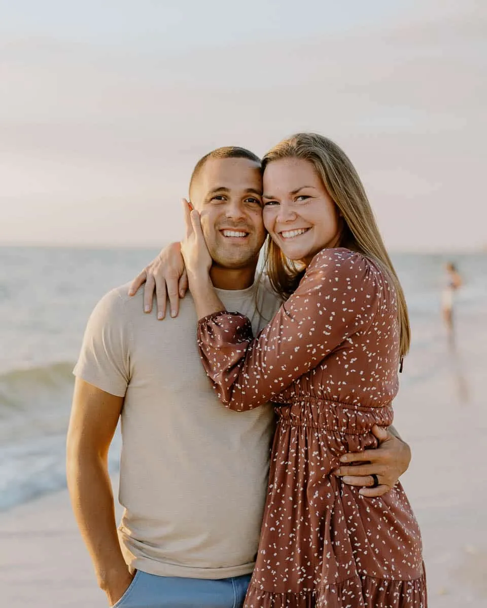 Couple embracing at sunset on Siesta Key Beach in spring