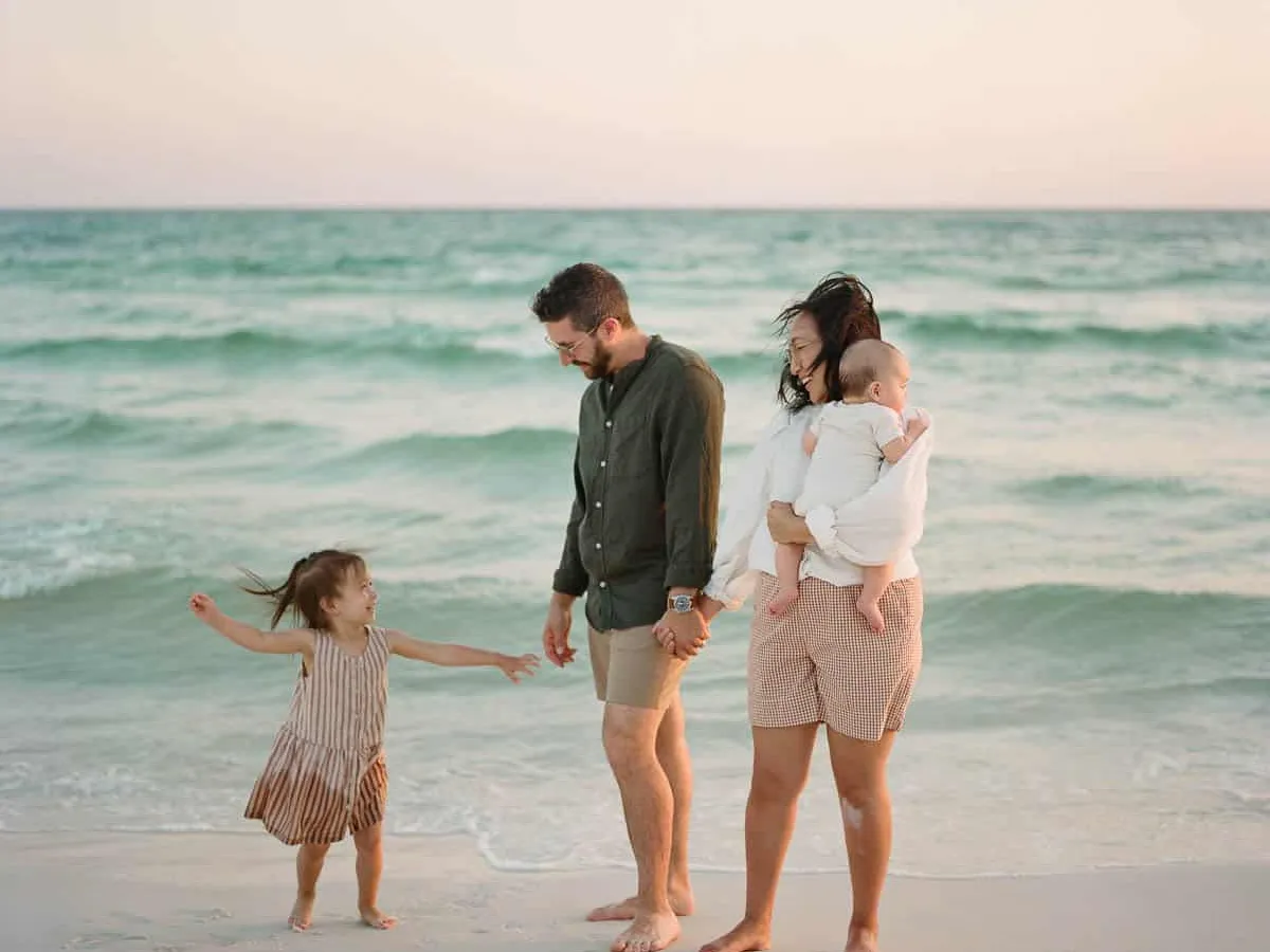 Family of four with young children on the sand at Siesta Key Beach