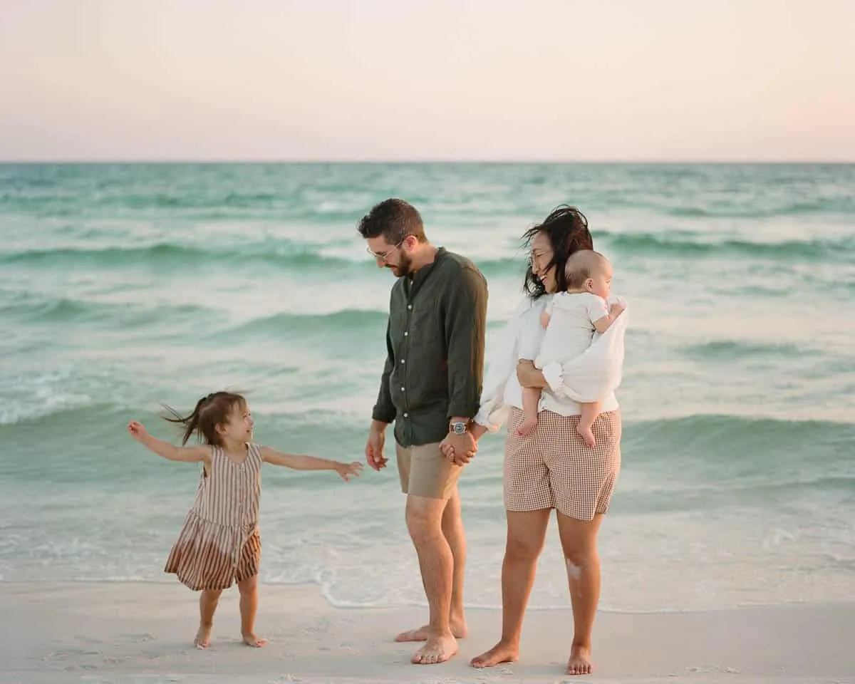 Family of four with young children on the sand at Siesta Key Beach
