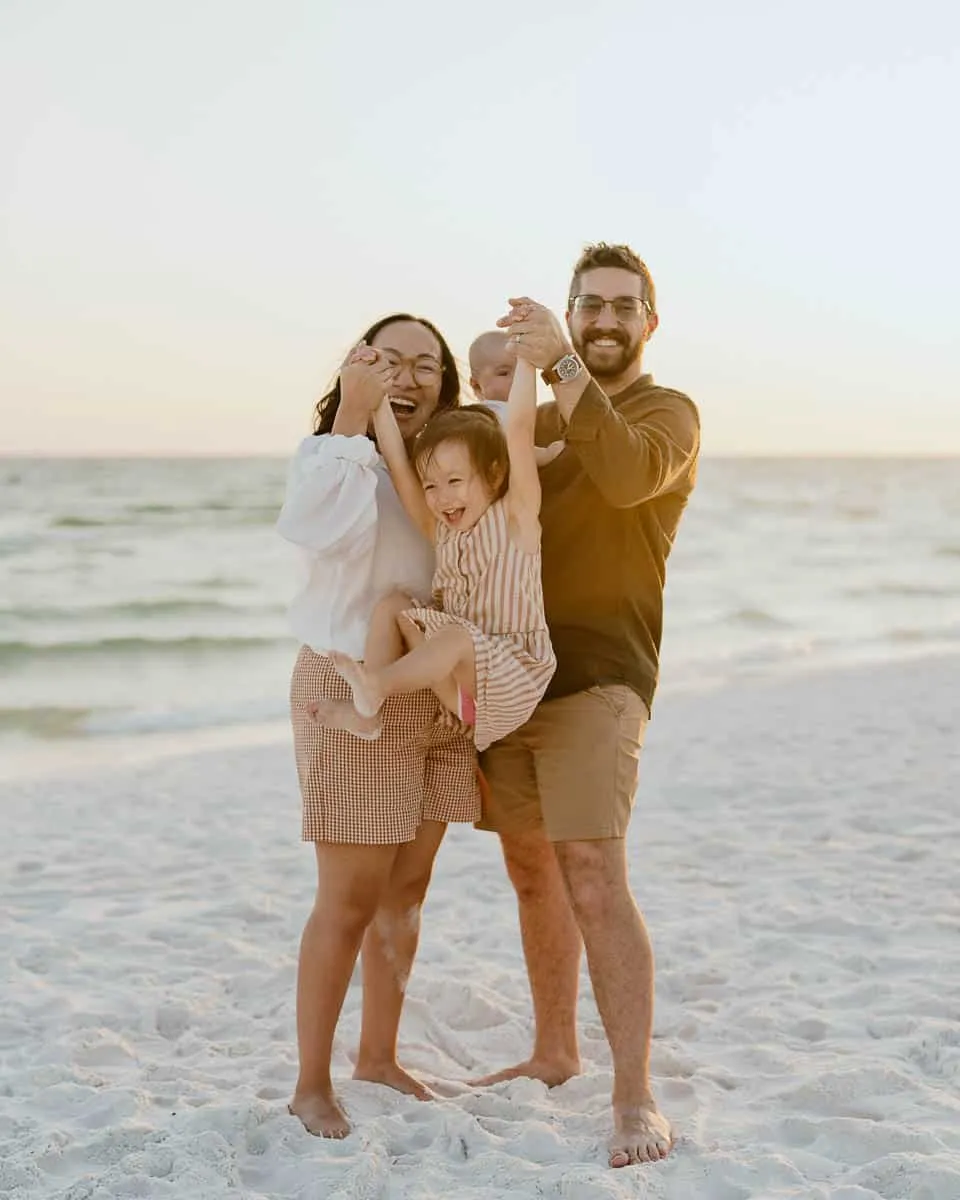 Family of four with young children on the sand at Siesta Key Beach