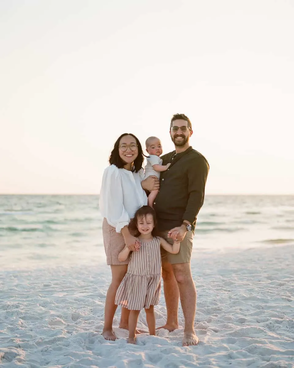 Family of four with young children on the sand at Siesta Key Beach