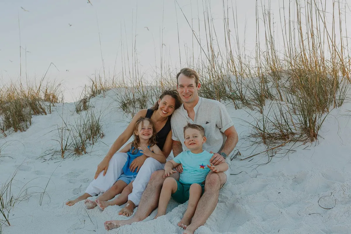 Three generations of a family together at Siesta Beach in soft evening light