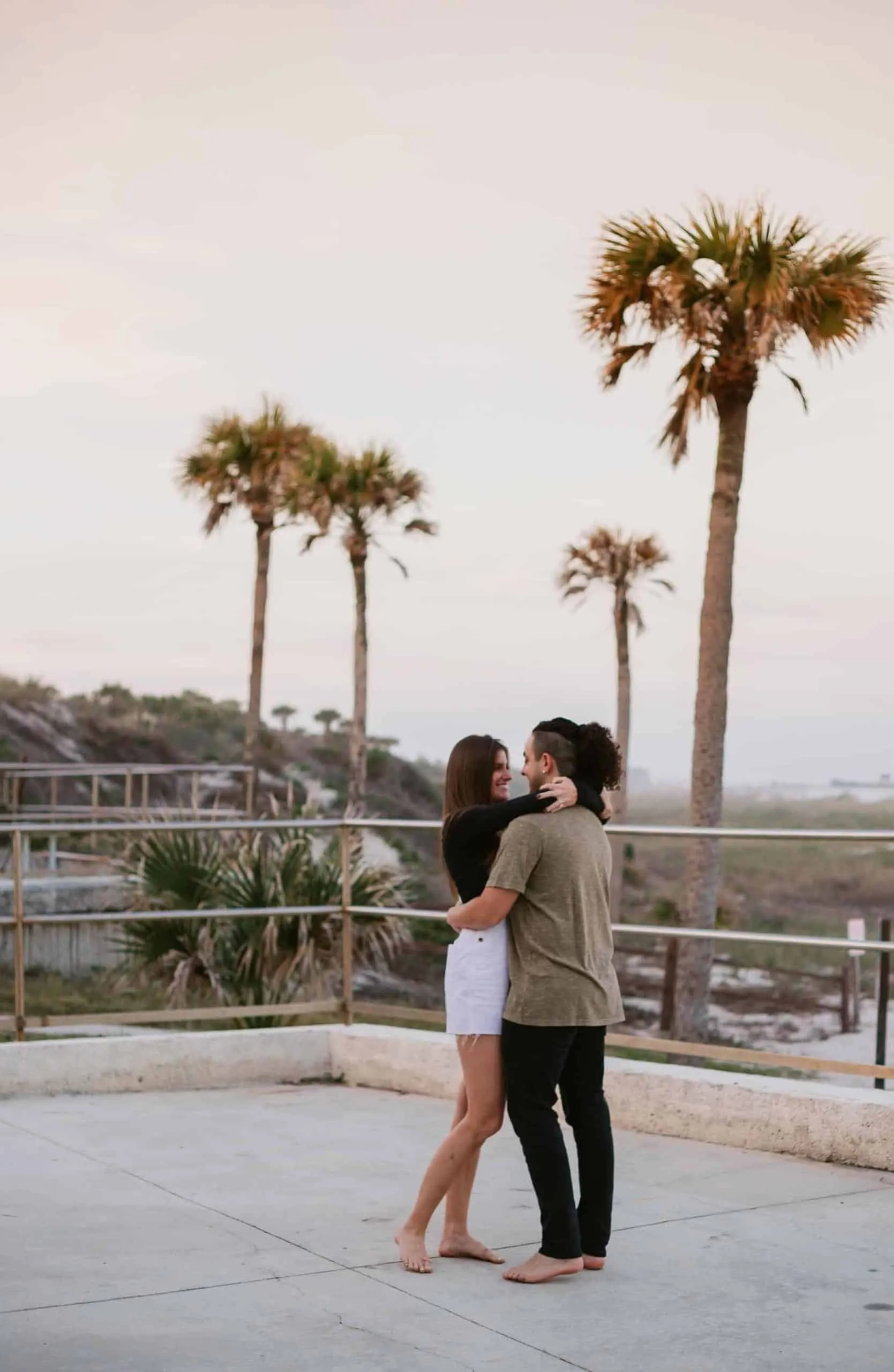 Couple together at The Poles Beach in Jacksonville for an anniversary session