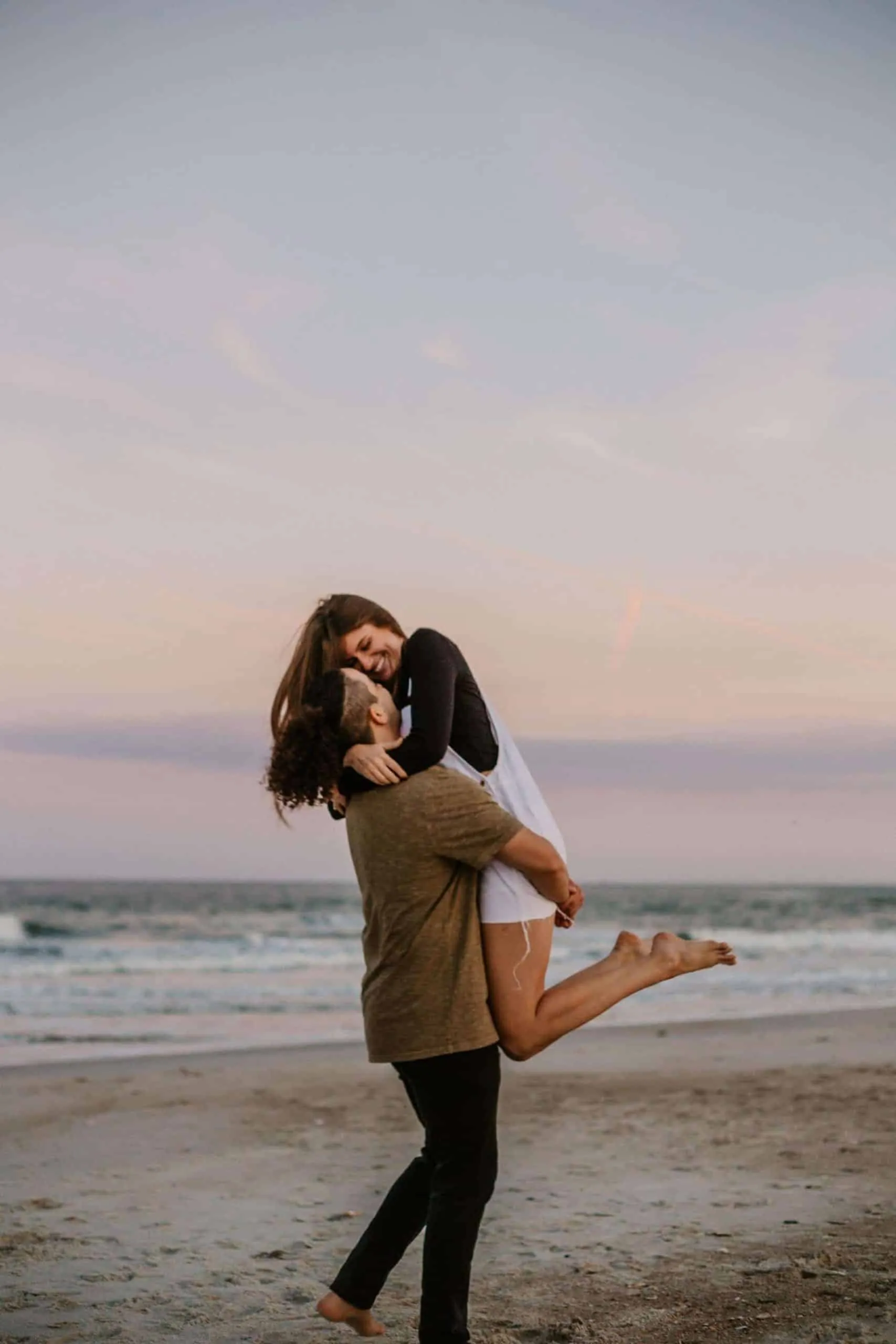 Couple together at The Poles Beach in Jacksonville for an anniversary session