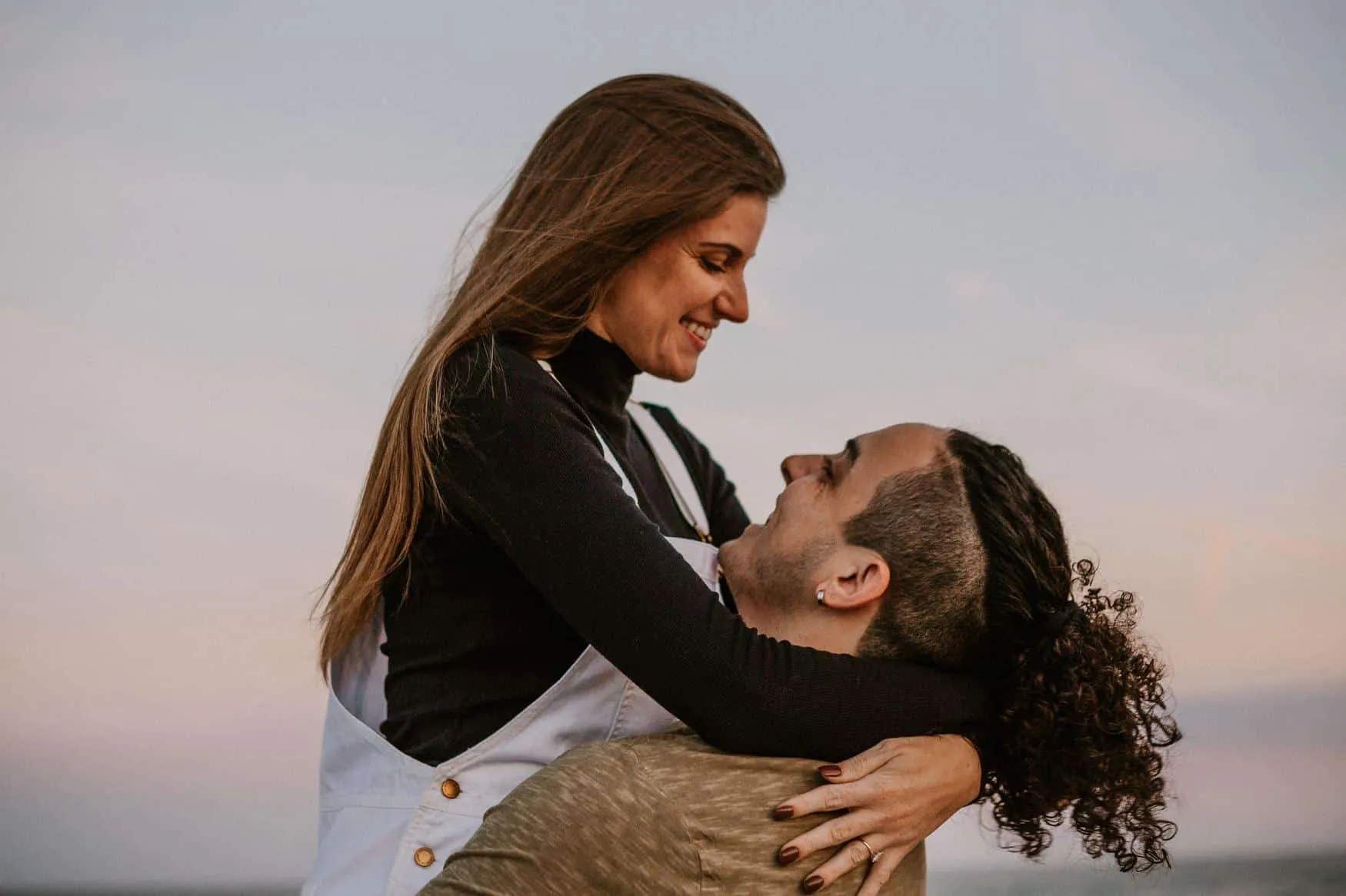 Couple together at The Poles Beach in Jacksonville for an anniversary session