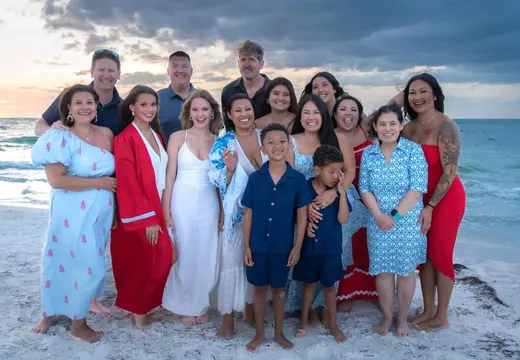 Family on the beach at sunset on Anna Maria Island, Florida